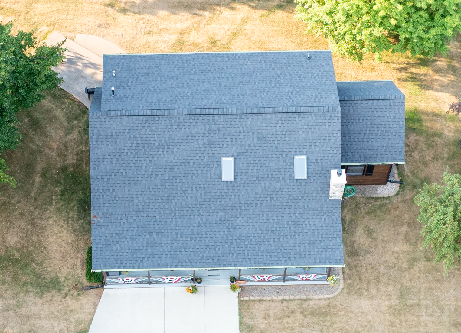 Aerial view of a Northwoods home with architectural shingles, skylights and ridge ventilation